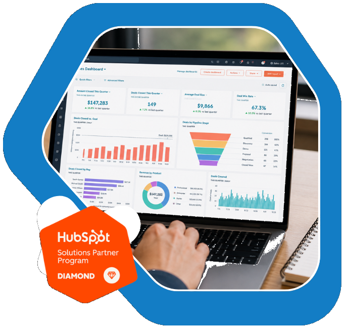 Laptop showing the HubSpot Deals Dashboard, with the HubSpot Diamond Partner badge and a blue graphic shape behind it